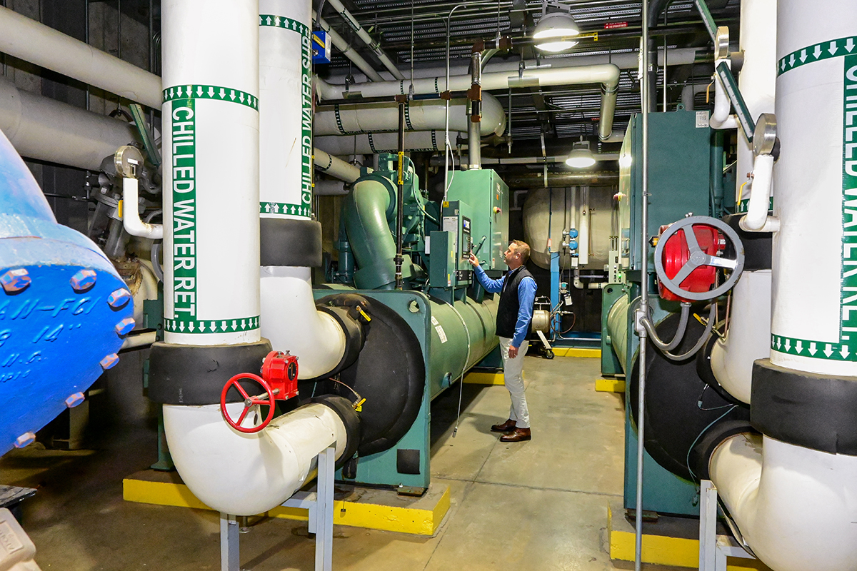 Mechanical engineer examining water chillers