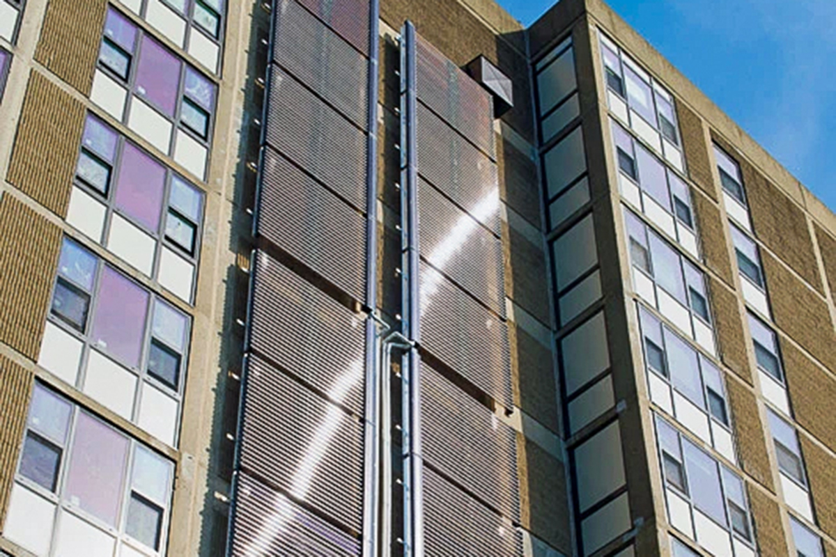 Solar thermal panels on the side of Ohav Sholom, an apartment building.