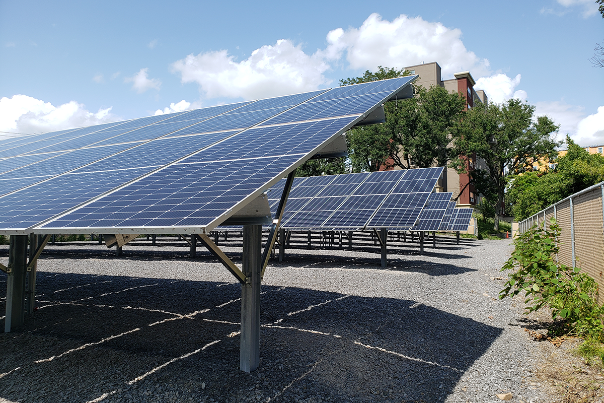 Rows of solar photovoltaic panels that provide electricity for a senior housing community in Rome, NY.