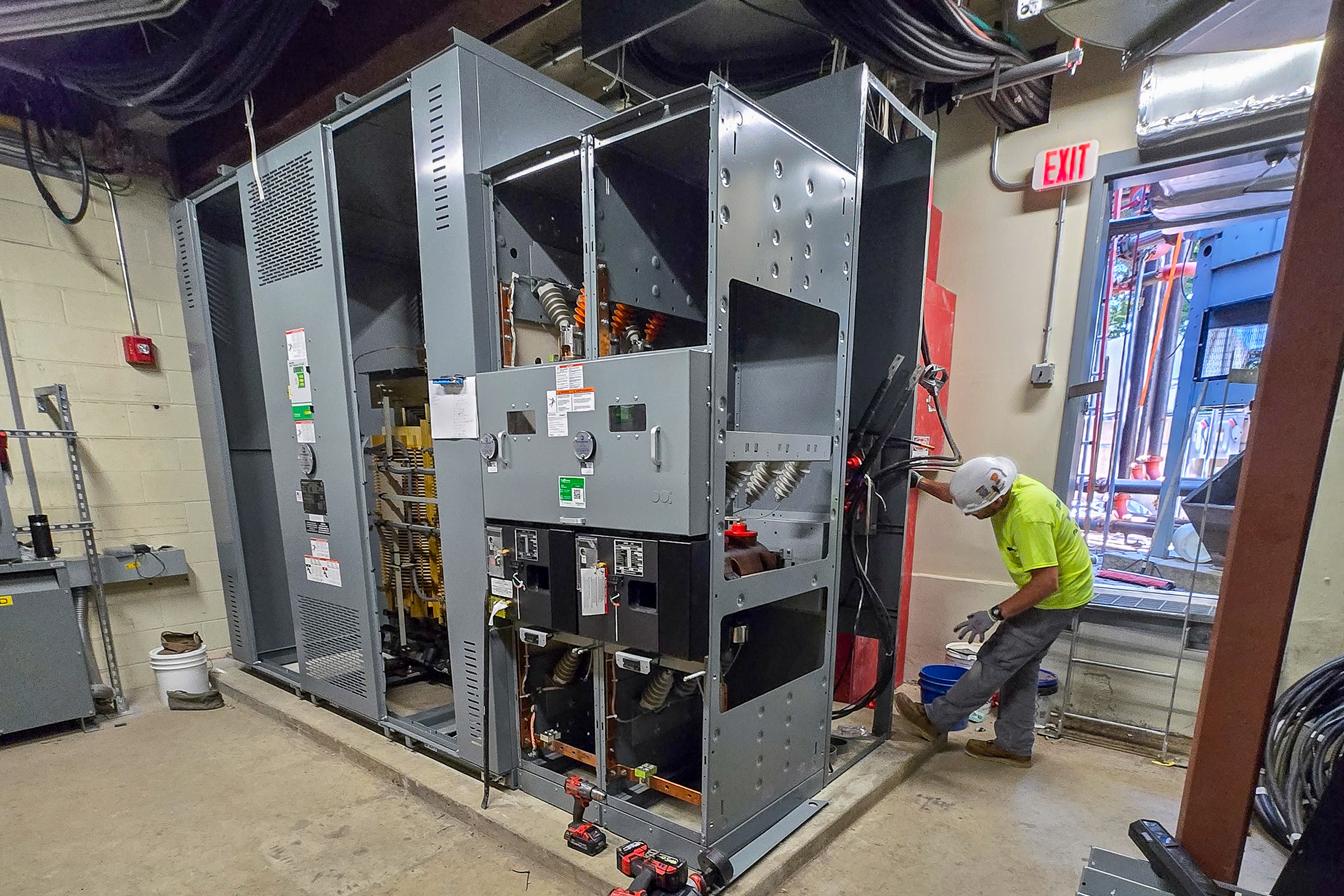 Electrical technicians installing new 480V transformers into Overlook Medical Center's electrical infrastructure.
